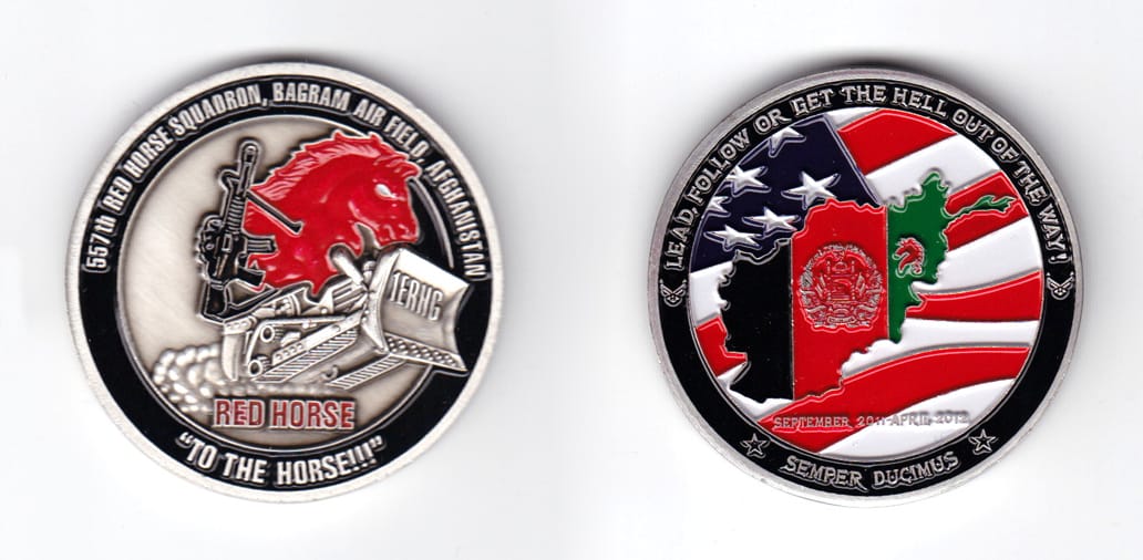 Round shaped coin, pewter in color, 1 61/64 inches in diameter.