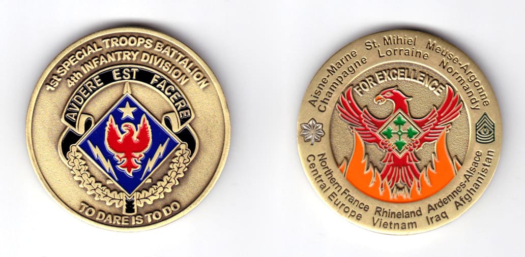 Round shaped coin, brass in color, 2 inches in diameter.