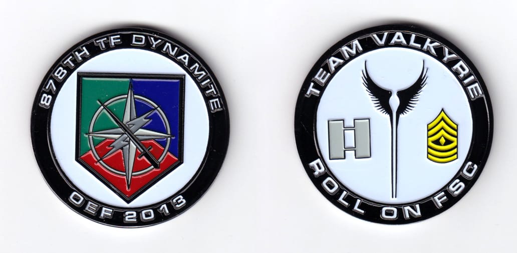 Round shaped coin, pewter in color, 2 inches in diameter.