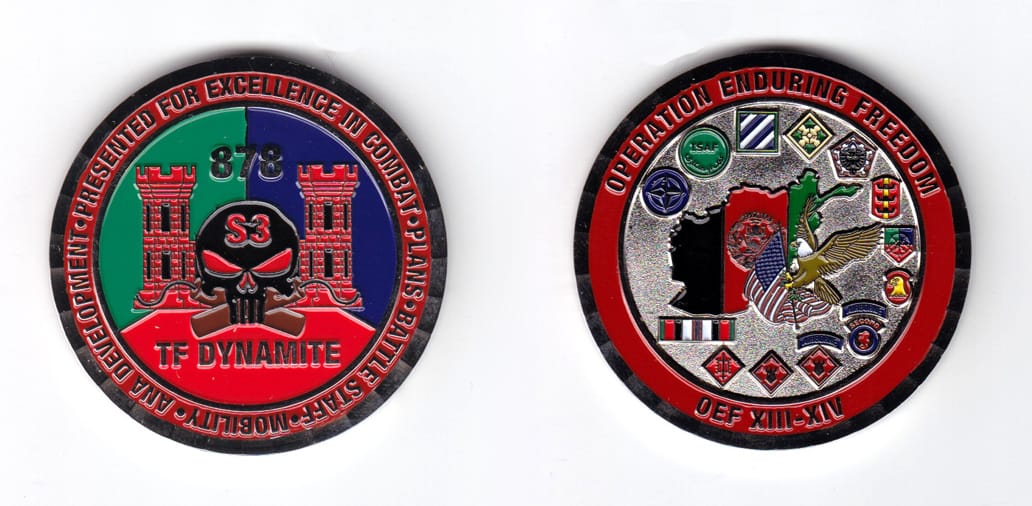 Round shaped coin, pewter in color, 2 1/64 inches in diameter.