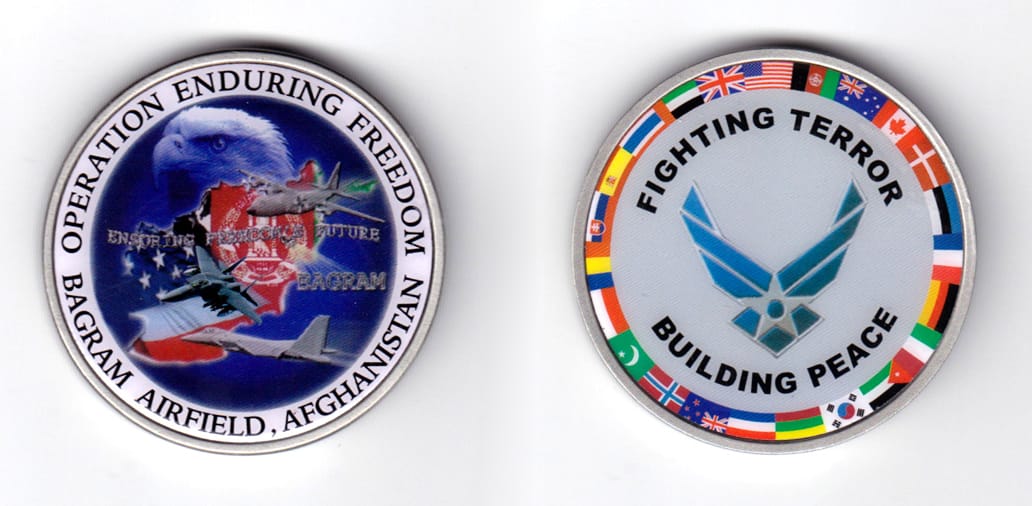 Round shaped coin, pewter in color, 2 inches in diameter.