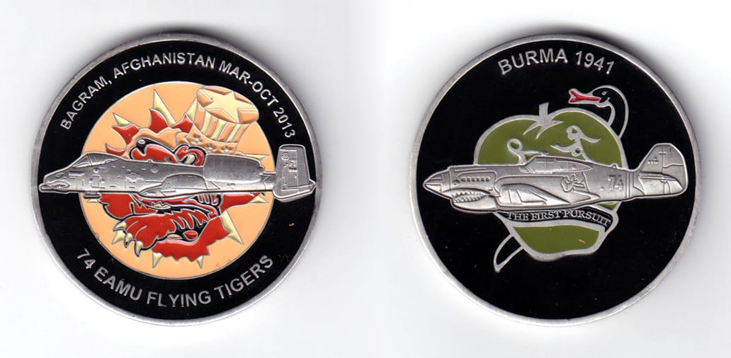 Round shaped coin, pewter in color, 2 inches in diameter.