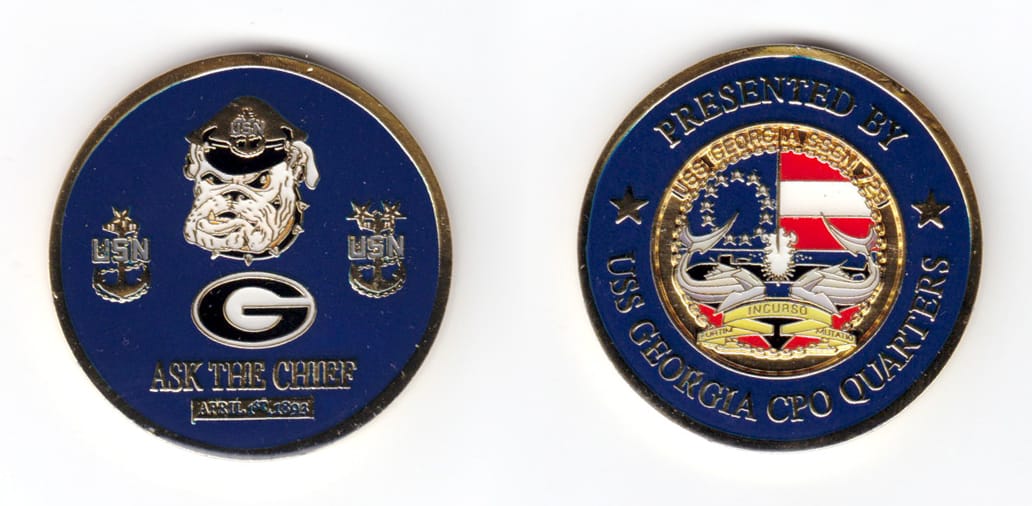 Round shaped coin, brass in color, 1 47/64 inches in diameter.