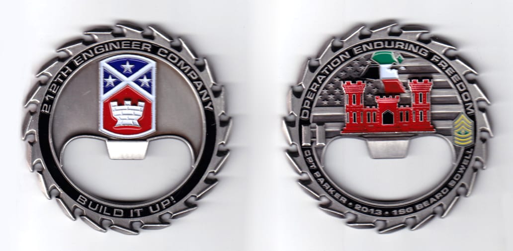 Circular saw blade shaped bottle opener, pewter in color, 2 1/2 inches in diameter.