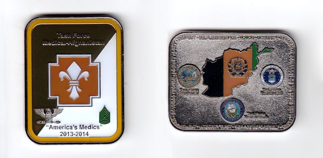 Rectangular shaped coin, pewter in color, 2 1/4 inches high x 1 3/4 inches wide.