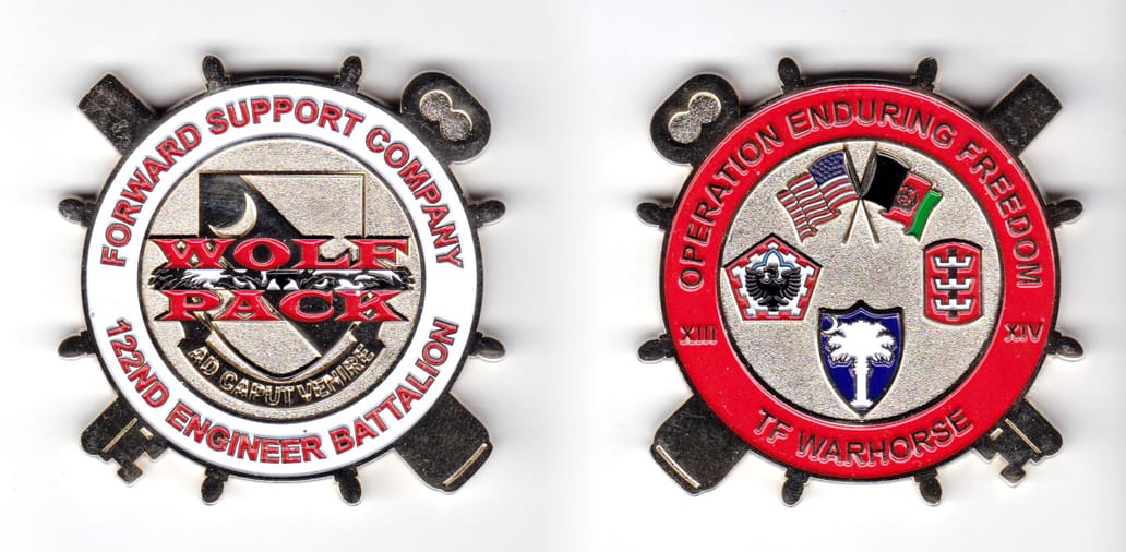 Round transportation-insignia-shaped coin with crossed key and cannon behind, brass in color, 2 1/8 inches high x 2 1/4 ...