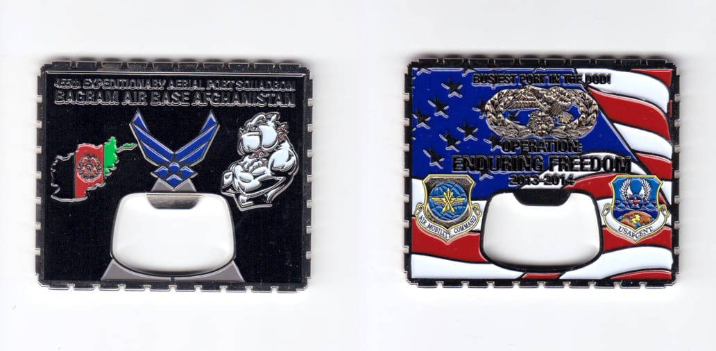 Rectangular shaped coin with multiple indentations all around, silber in color, 2 1/8 inches high x 2 1/2 inches wide.