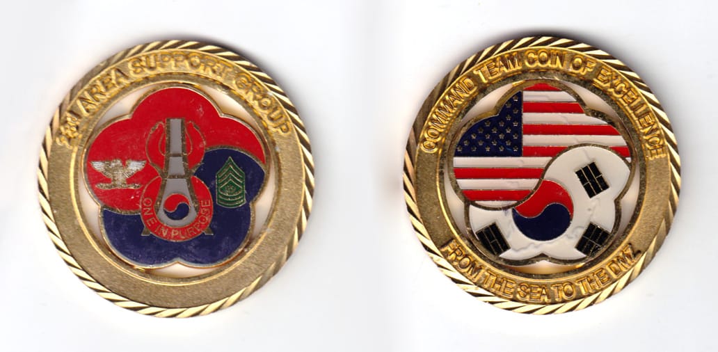 Round shaped coin, brass in color, 2 inches in diameter.