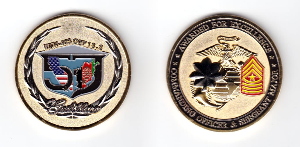 Round shaped coin, brass in color, 2 inches in diameter.