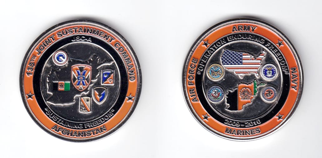 Round shaped coin, silver in color, 2 inches in diameter.