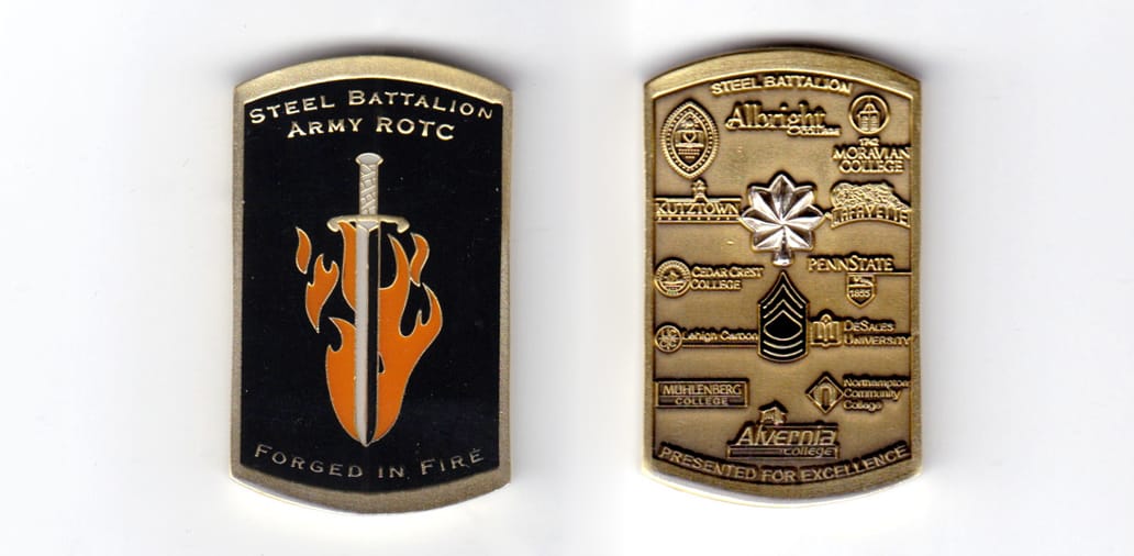 Rectangular shaped coin with short ends bowed outward, brass in color, 2 inches high x 1 1/4 inches wide.