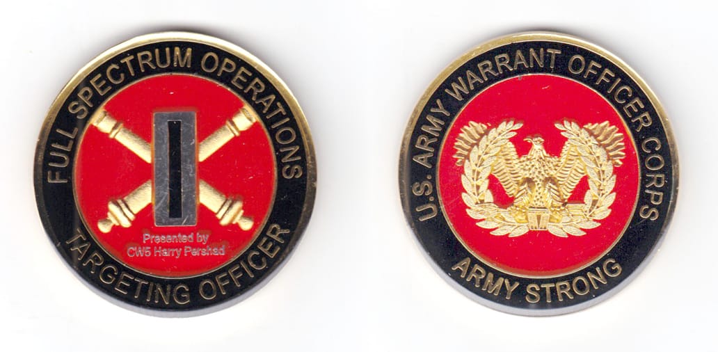 Round shaped coin, brass in color, 2 inches in diameter.