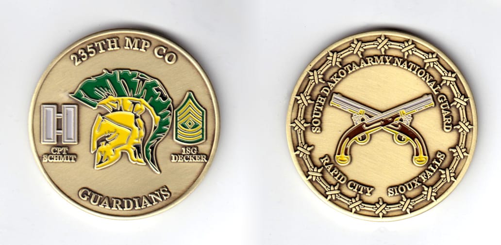 Round shaped coin, brass in color, 2 inches in diameter.