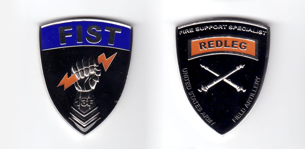 Shield shaped coin pewter in color, 2 inches high x 1 9/16 inches wide.