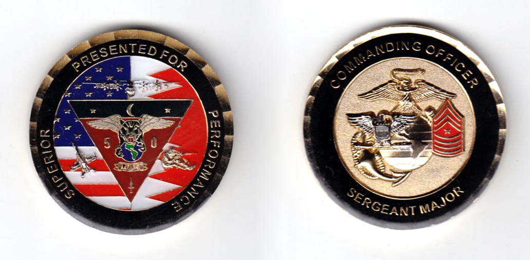 Round shaped coin, brass in color, 1 3/4 inches in diameter.