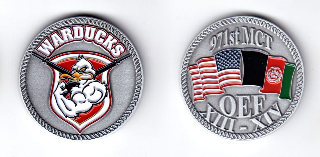 Round shaped coin, pewter in color, 1 3/4 inches in diameter.