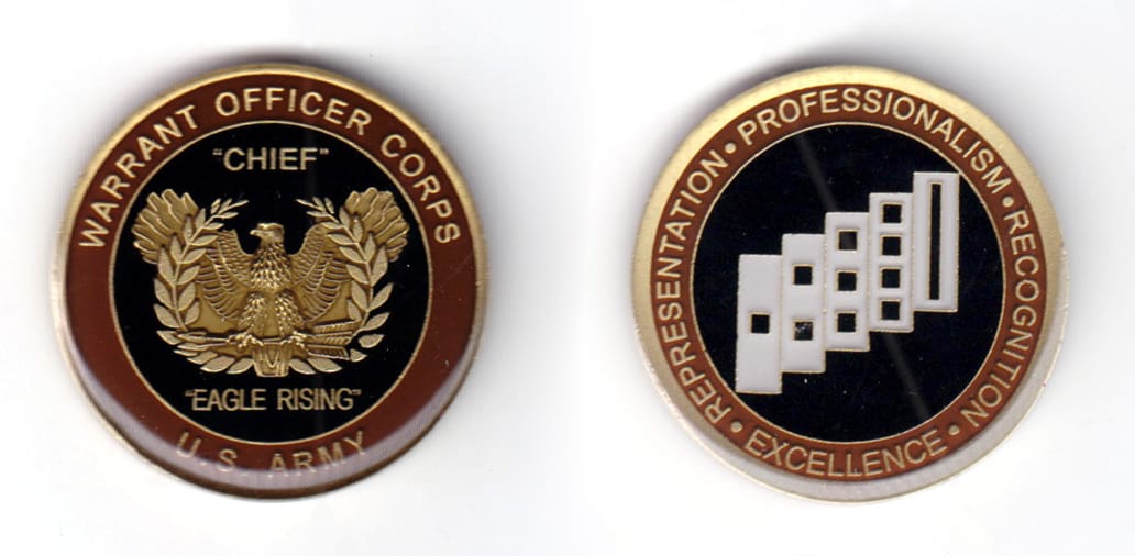 Round shaped coin, pewter in color, 1 5/8 inches in diameter.