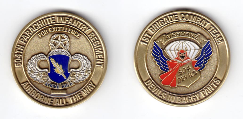 Round shaped coin, brass in color, 1 5/8 inches in diameter.