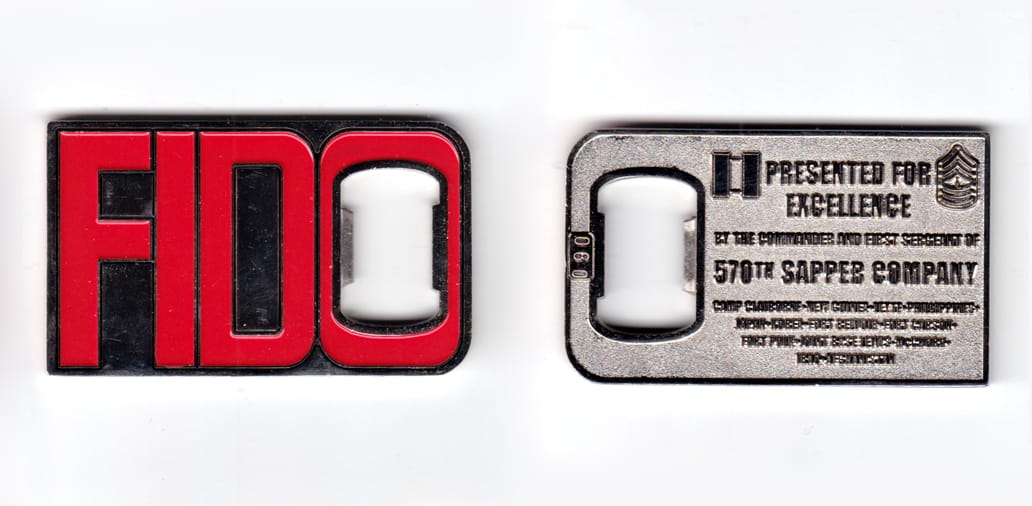 Rectangular shaped coin with bottle opener cutout, brass in color. 1 5/8 inches high x 2 3/4 inches wide.