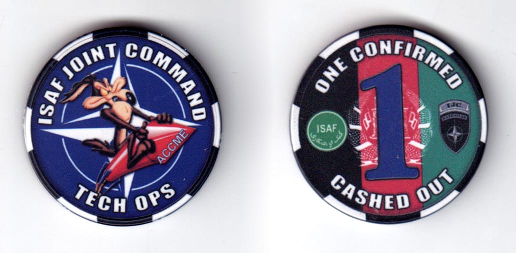 Round shaped poker chip, black & white in color, 1 1/2 inches in diameter.