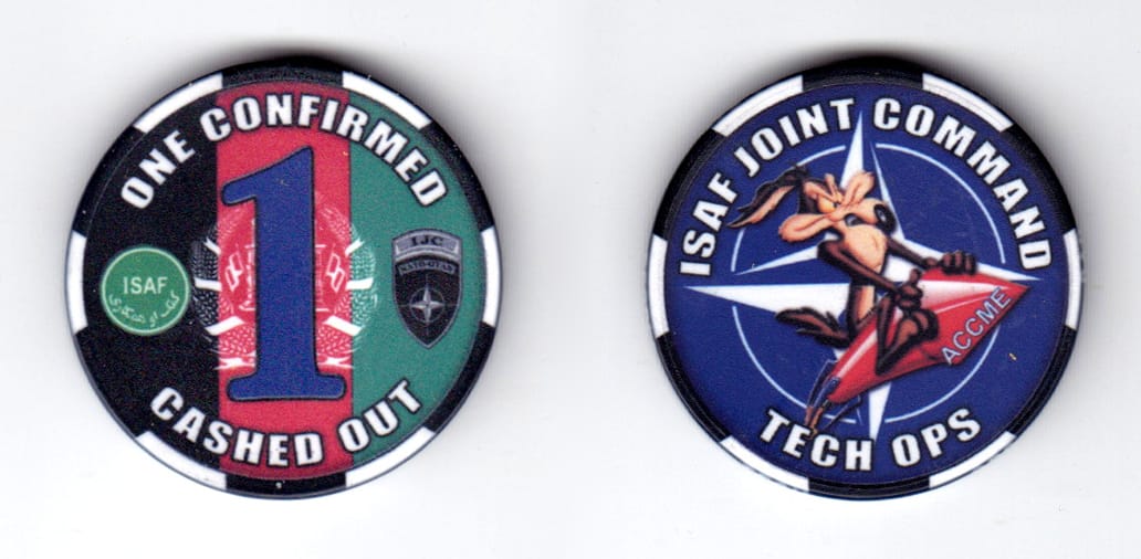 Round shaped poker chip, black & white in color, 1 1/2 inches in diameter.