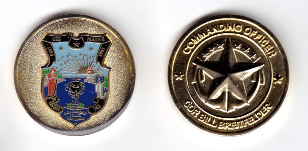 Round shaped coin, brass in color, 1 1/2 inches in diameter.