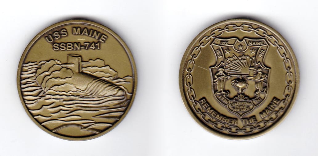 Round shaped coin, olive drab in color, 1 1/2 inches in diameter.