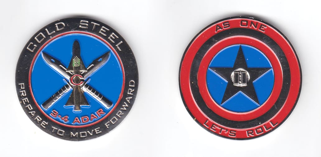 Round shaped coin, pewter in color, 2 inches in diameter.