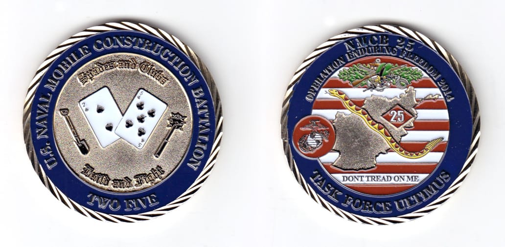 Round shaped coin, brass in color, 2 inches in diameter.