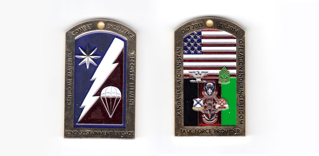 Rectangular coin on end with rounded top, brass in color, 2 1/2 inches high x 1 1/2 inches wide.