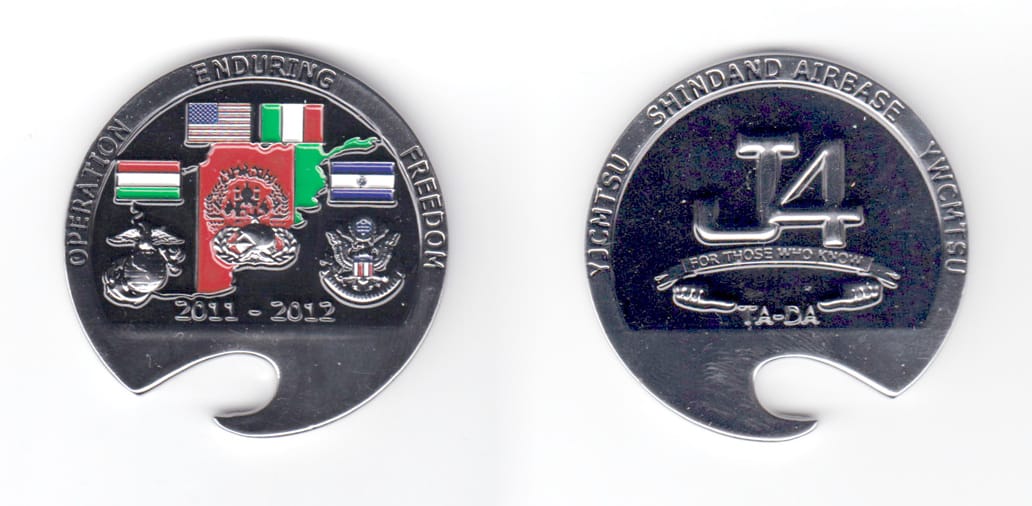 Round shaped coin with a cutout makine it into a bottle opener, silver in color, 2 inches in diameter.