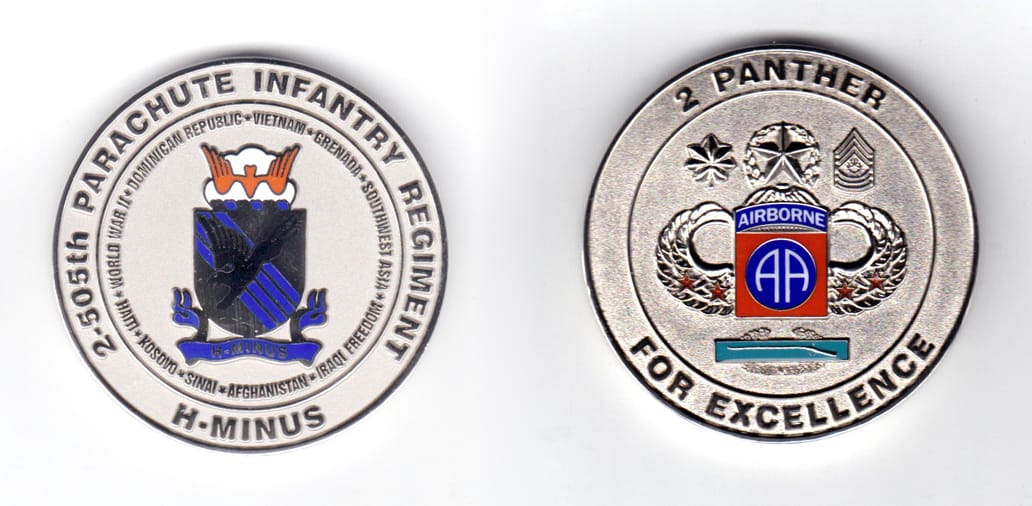 Round shaped coin, silver in color, 2 inches in diameter.