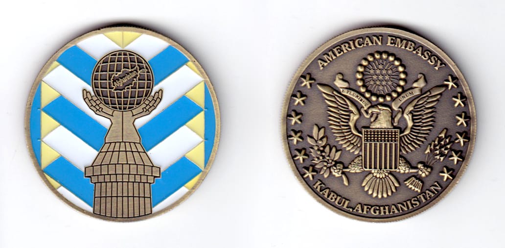 Round shaped coin, antique brass in color, 1 3/4 inches in diameter.