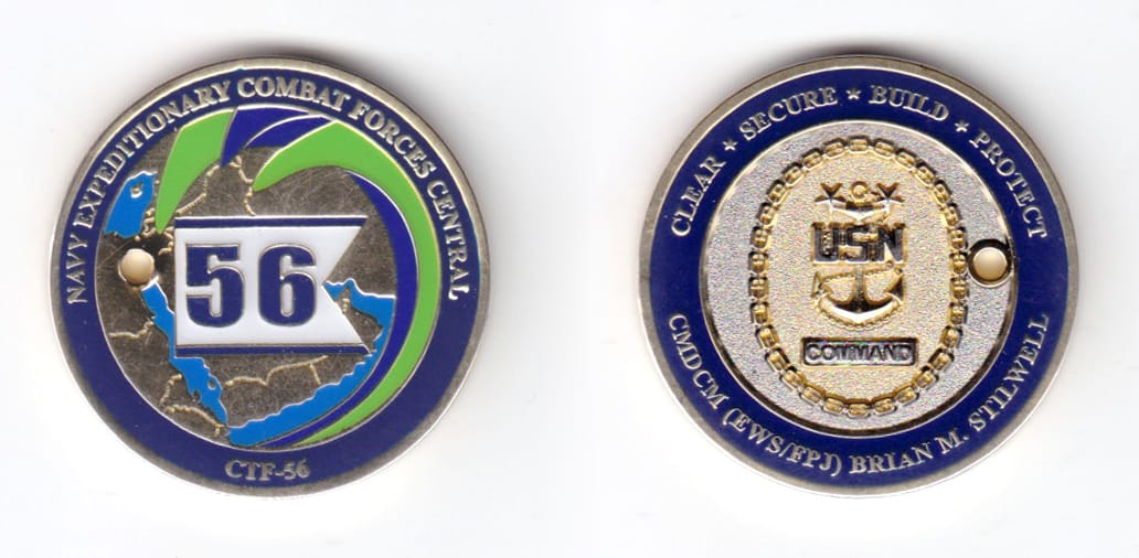 Round shaped coin, silver in color, 1 1/2 inches in diameter.