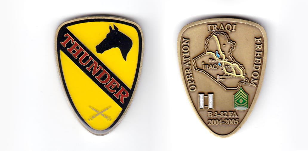 Shield shaped coin, antique brass in color, 2 inches high x 1 1/2 inches wide.