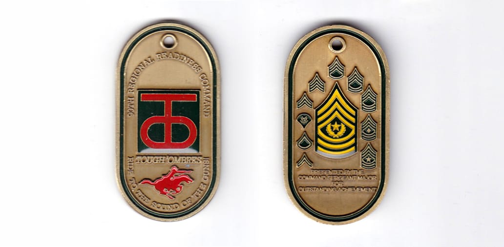 Dog tag shaped coin, antique brass in color, 2 1/2 inches high x 1 1/4 inches wide.