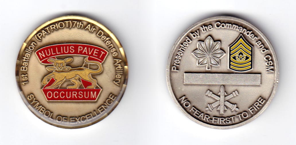 Round shaped coin, pewter in color, 1 5/8 inches in diameter.