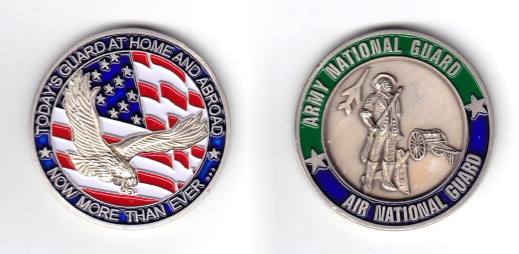 Round shaped coin, pewter in color, 1 5/8 inches in diameter.