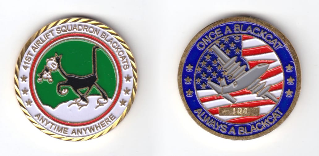 Round shaped coin, brass in color, 1 1/2 inches in diameter.