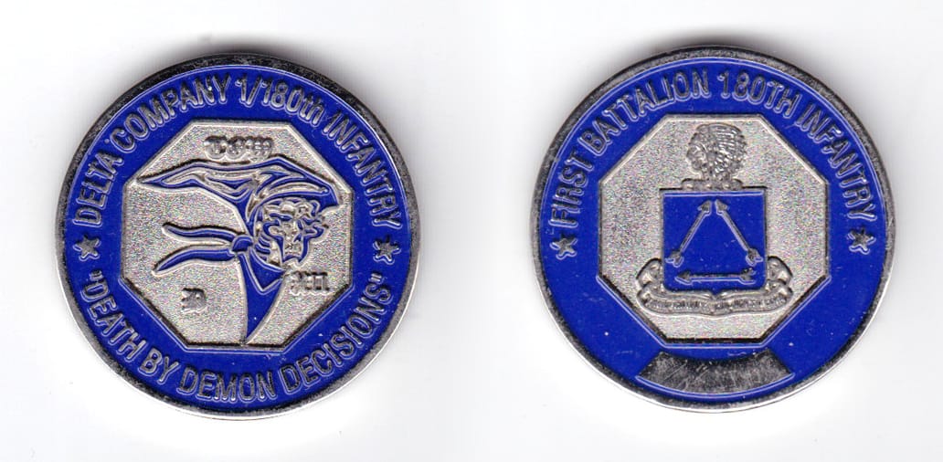 Round shaped coin, pewter in color, 1 1/2 inches in diameter.