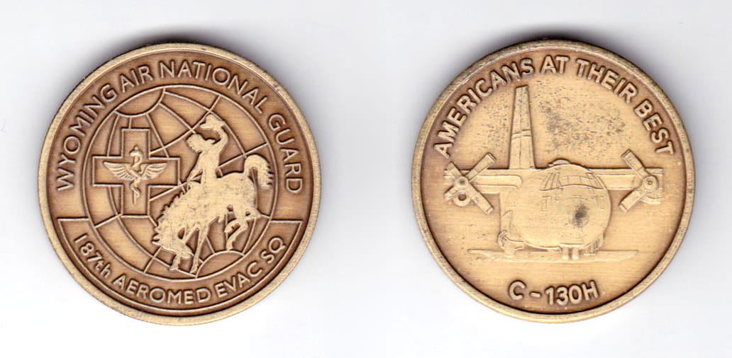 Round shaped coin, antique brass in color, 1 1/2 inches in diameter.