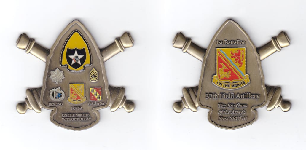 Arrowhead shaped coin, antique brass in color, 2 1/2 inches high x     2 3/4 inches wide.