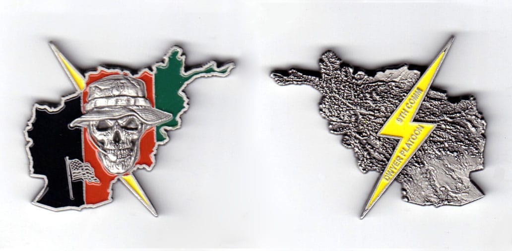 Coin is shaped like outline of the Afghan map with a lightning bolt behind; color if antique pewter and size is 1 5/8 in...