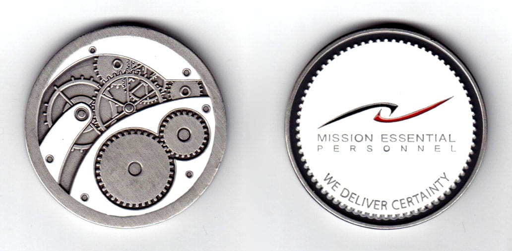 Round shaped coin, pewter in color, 1 3/4 inches in diameter.