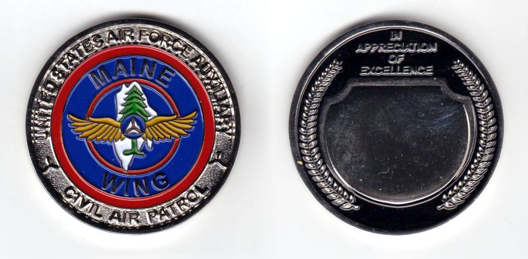 Round shaped coin, pewter in color, 1 3/4 inches in diameter.