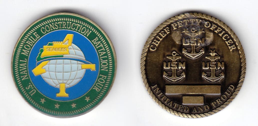 Round shaped coin, antique brass in color, 1 1/2 inches in diameter.