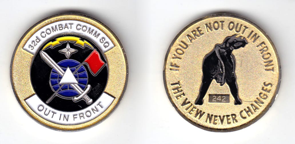 Round shaped coin, brass in color, 1 1/2 inches in diameter.