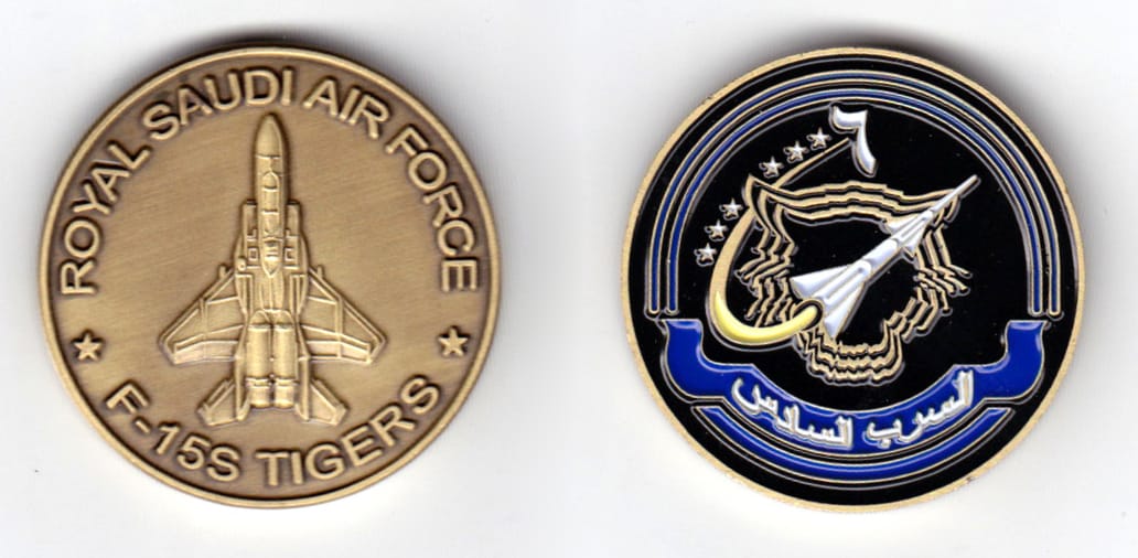 Round shaped coin, brass in color, 1 1/2 inches in diameter.