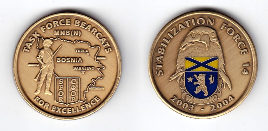 Round shaped coin, antique brass in color, 1 1/2 inches in diameter.