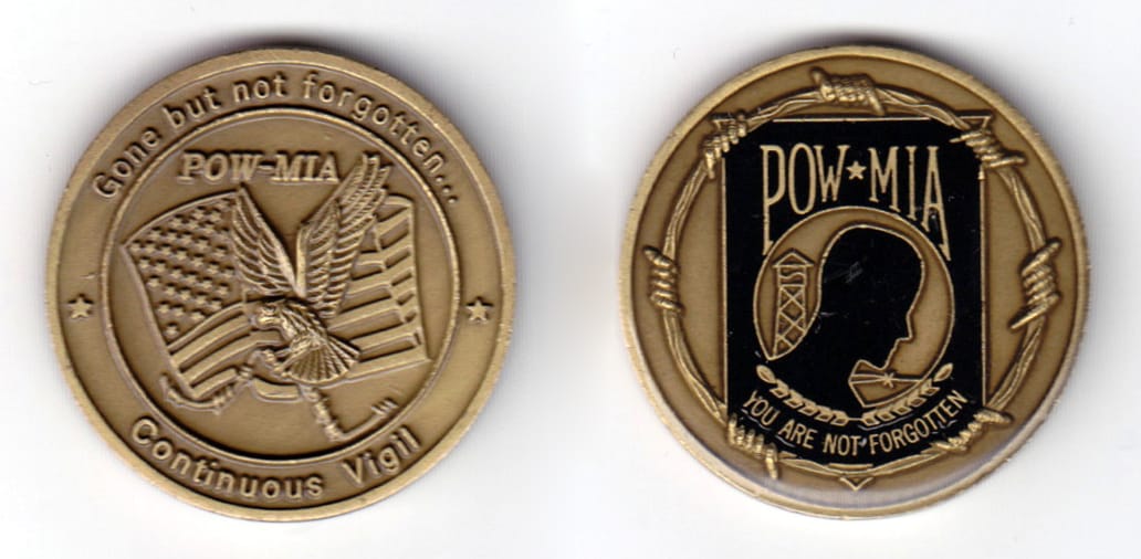 Round shaped coin antique brass in color, 1 1/2 inches in diameter.